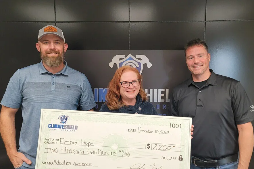 corporate partners present check to emberhope