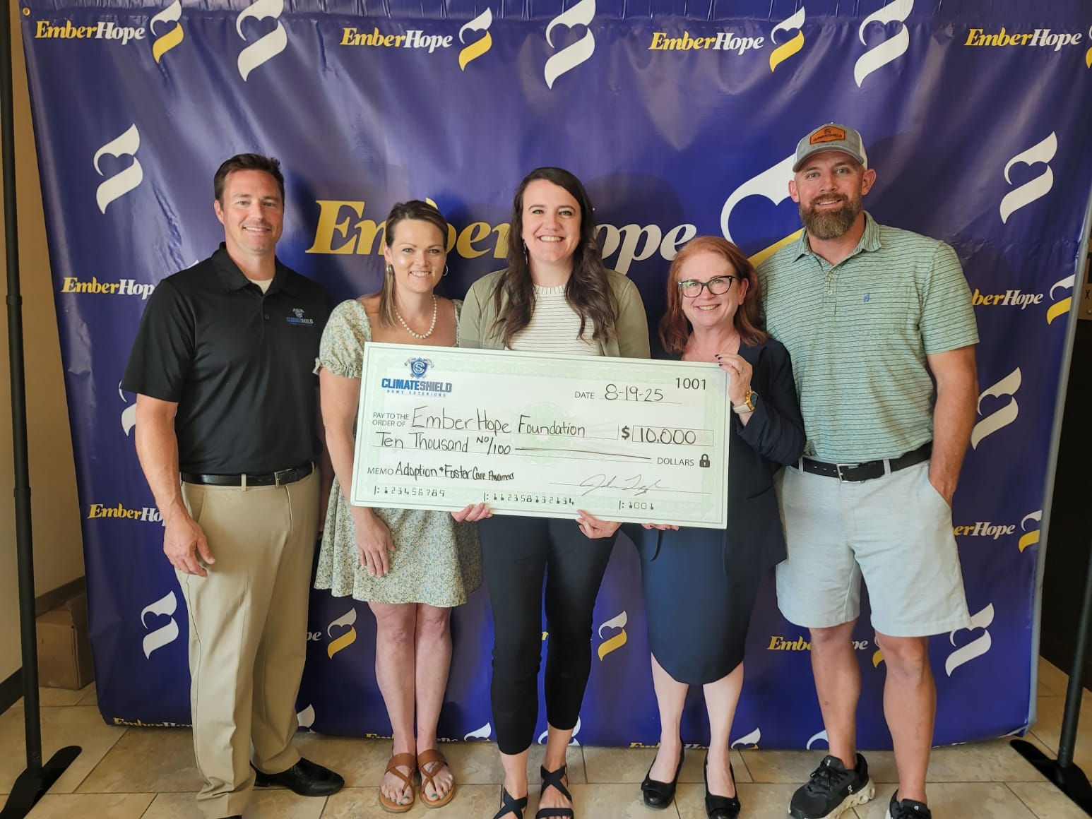 Climate Shield Home Exteriors donates check to support Kansas Foster Youth