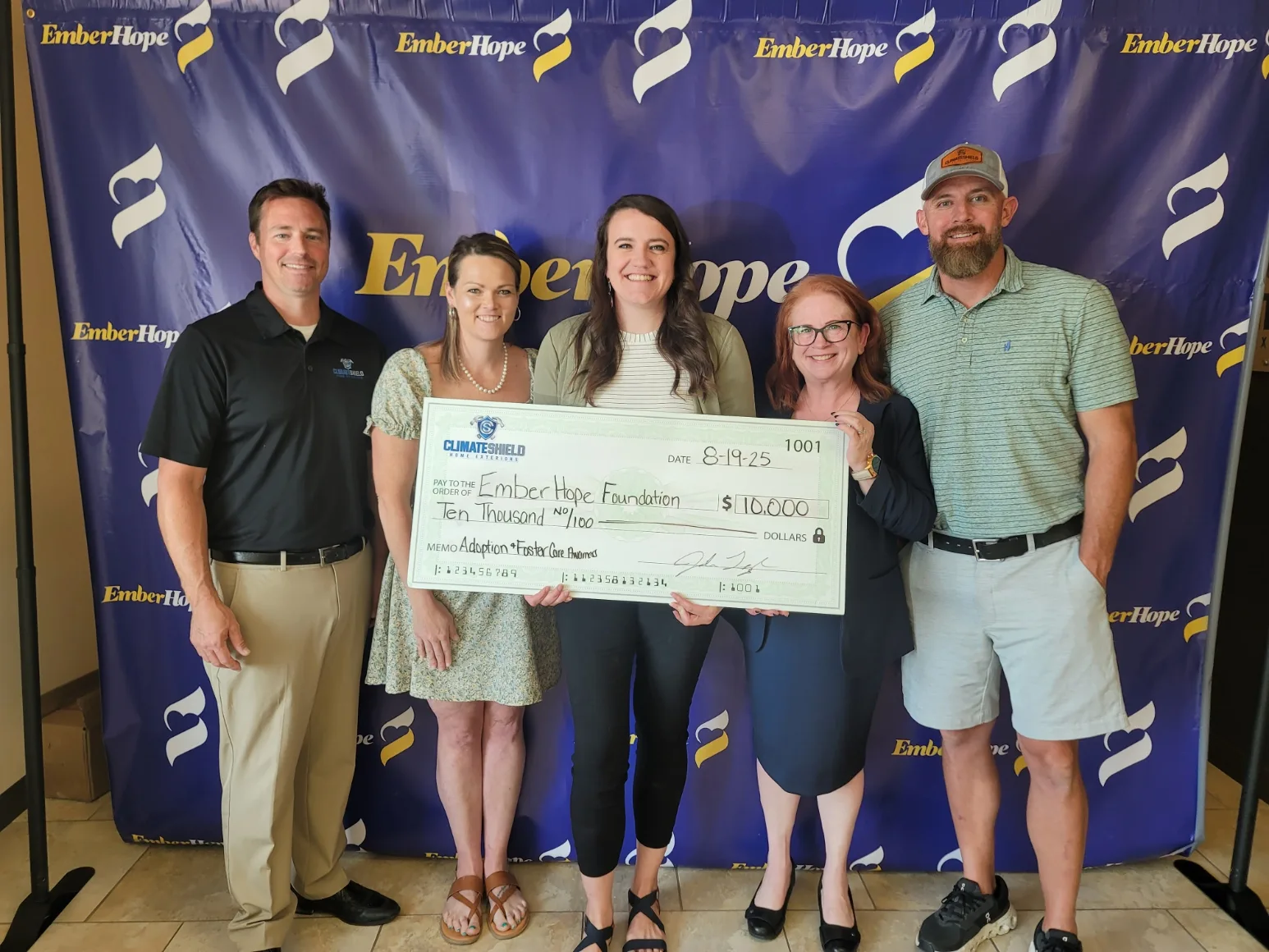 Climate Shield Home Exteriors donates check to support Kansas Foster Youth