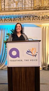 Constance Vanbuskirk giving her speech on the main stage