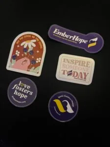EmberHope and wellness stickers on a table