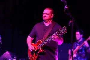 Jordan Tozier playing guitar