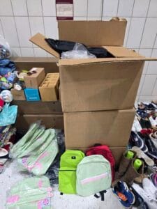 A box from Day1Bags with backpacks and duffel bags