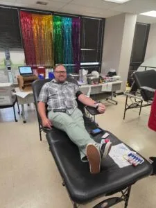 Sean Gardiner, the agency chaplain, donating blood during the blood drive