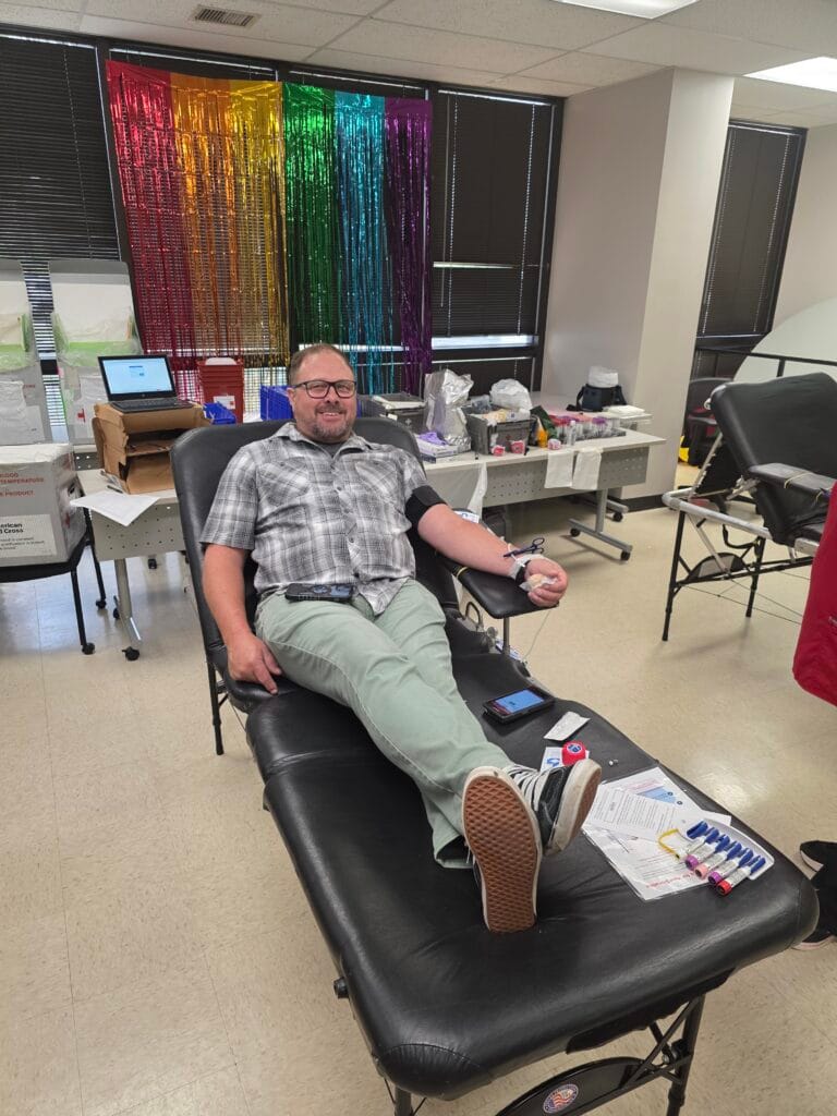 Sean Gardiner, the agency chaplain, donating blood during the blood drive