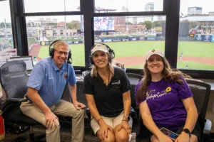 Nickaila Sandate, EmberHope President & CEO, being interviewed for ESPN Radio. Also pictured is Autumn Huerter, EmberHope Marketing Director