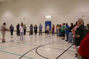 Connections Staff participating in a team building activity with exercise